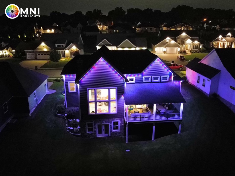 Aerial view of purple and blue permanent roofline lighting