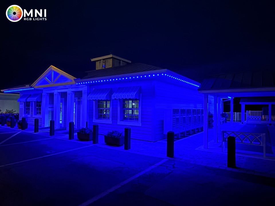 Blue permanent lighting on a commercial building with a cupola