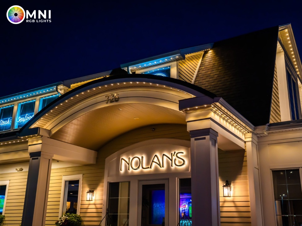 Warm white permanent lighting on a restaurant entrance archway
