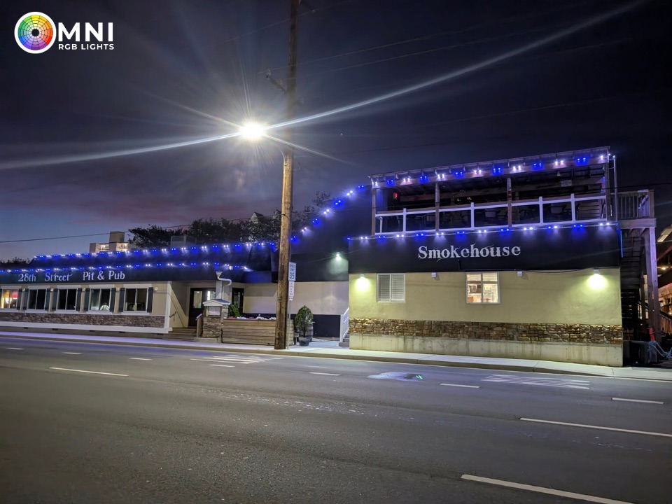 Blue permanent roofline lighting on a roadside restaurant