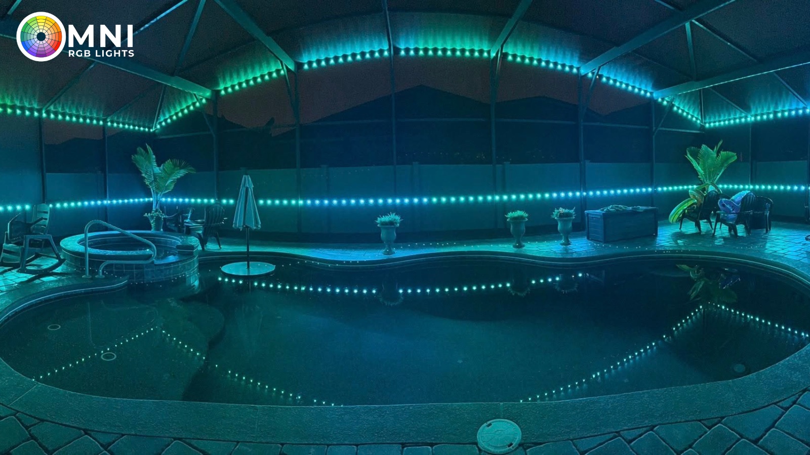 Teal and blue permanent RGB lighting on a screened pool cage