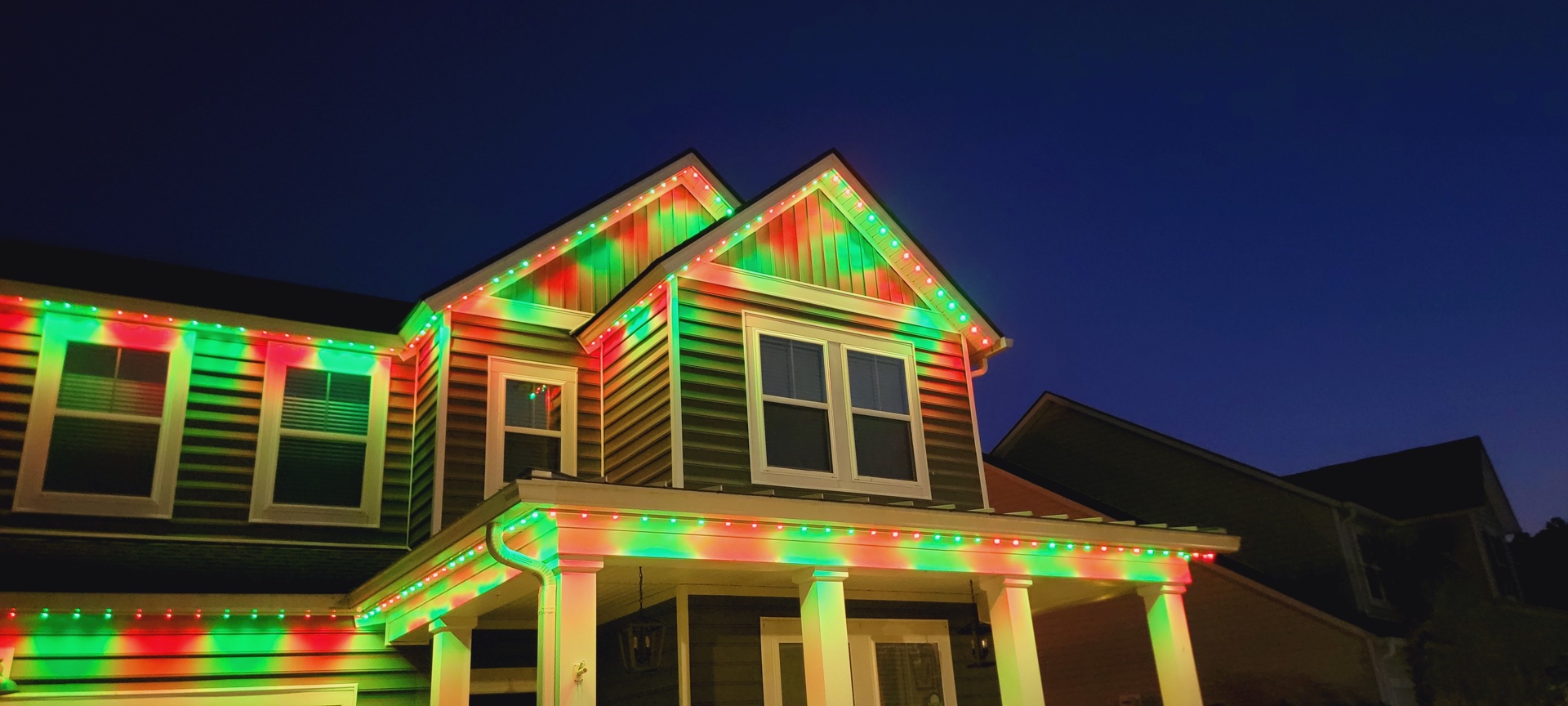 Residential permanent Christmas light installation Melbourne Florida holiday roofline